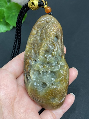 H22439310 Hetian Jade Pendant  Dragon  Total Weight (including rope) 139.7g  Undetermined skin color origin  Contains other natural mineral components