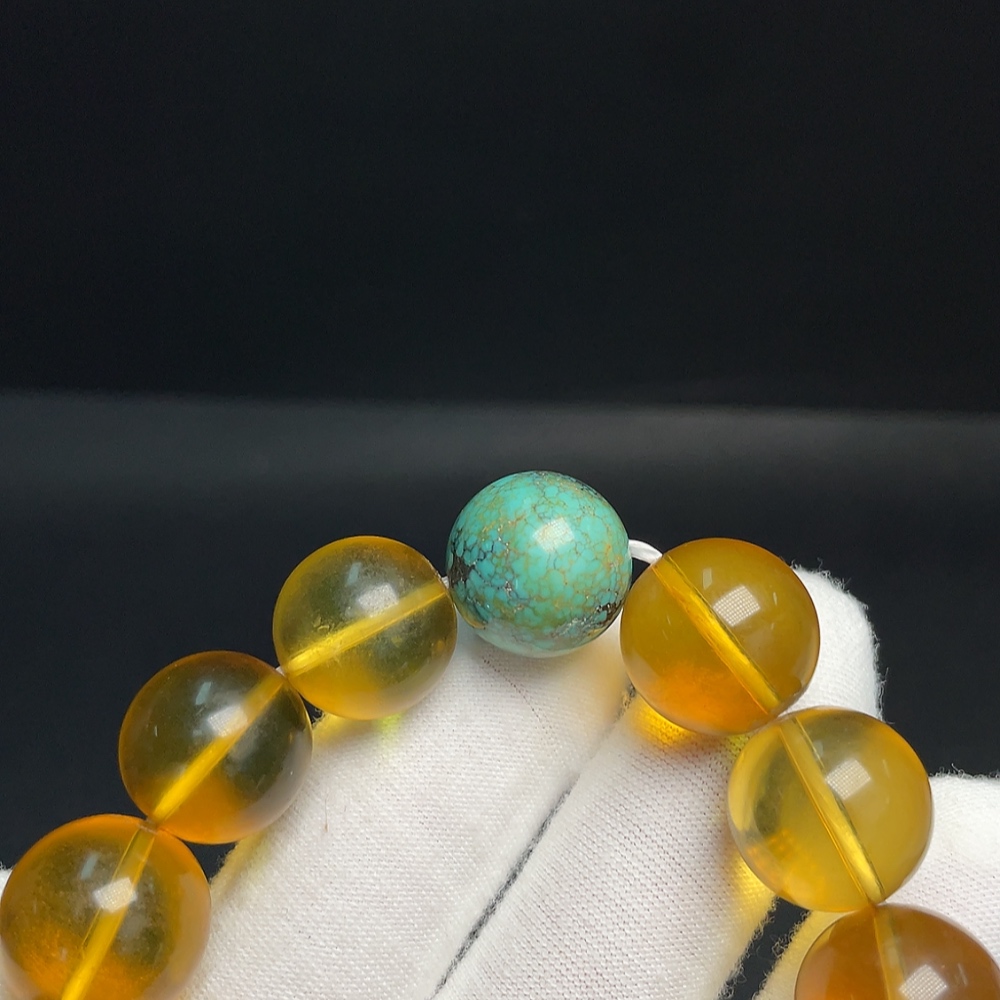 C33921132 Amber Beeswax Bracelet with Turquoise (color origin undetermined) containing other mineral components, total weight approx. 31.69g, size approx. 14.7mm