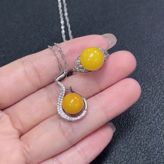 C29368481 Amber Beeswax Pendant + Ring Adjustable Non-Gold Total Weight Approx. 7.72g Sell as a Lot