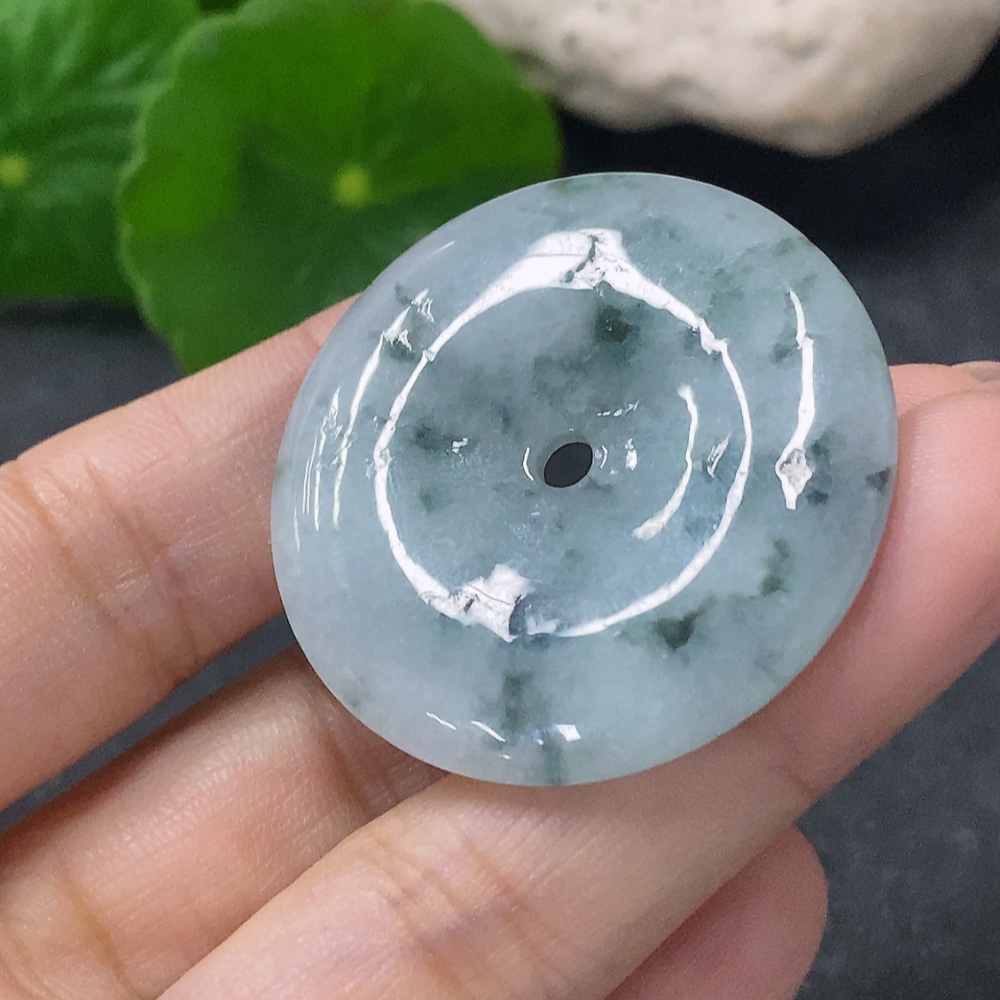 F34041946 Jadeite Pendant Peace Knot with an approximate total weight of 12.36g and containing other mineral components