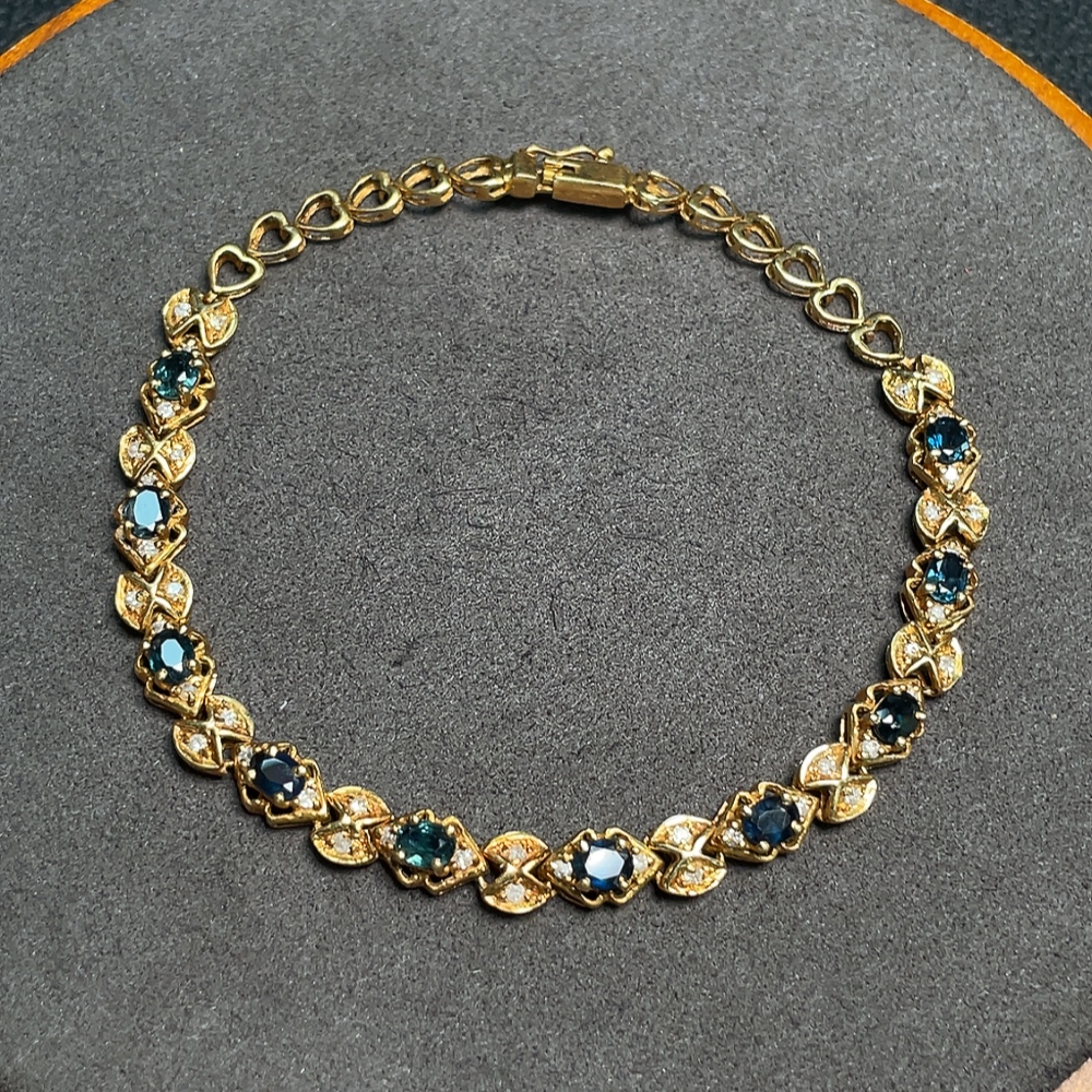 C33922202 Sapphire bracelet, color origin undetermined, accented with diamonds, no imprint, surface gold content approximately 75%, total item weight about 10.19 grams