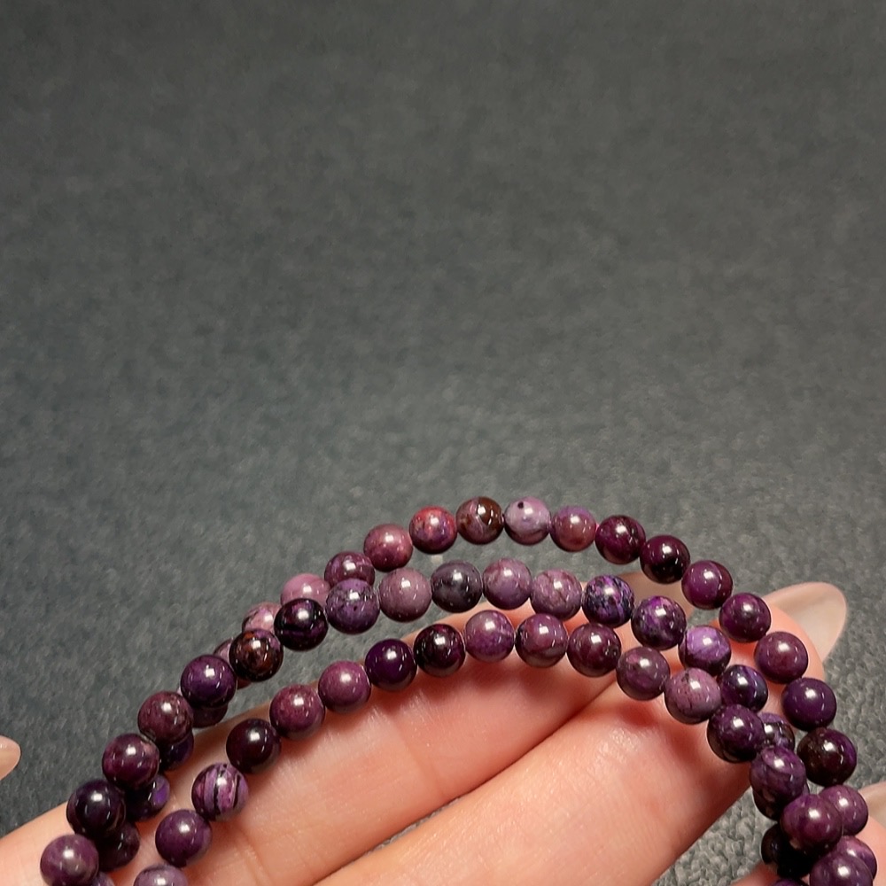 C34009644 Sugilite Bead Strand (with mineral inclusions)
