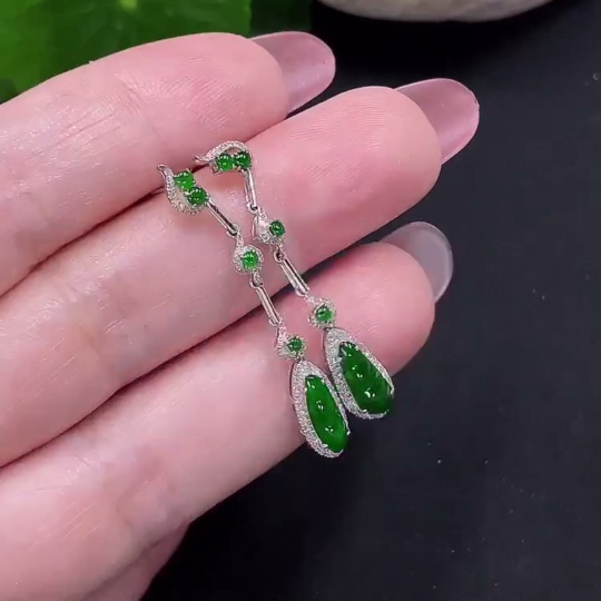 F34982006 Jadeite earrings set in 18K gold with diamonds, total weight approximately 2 grams per pair