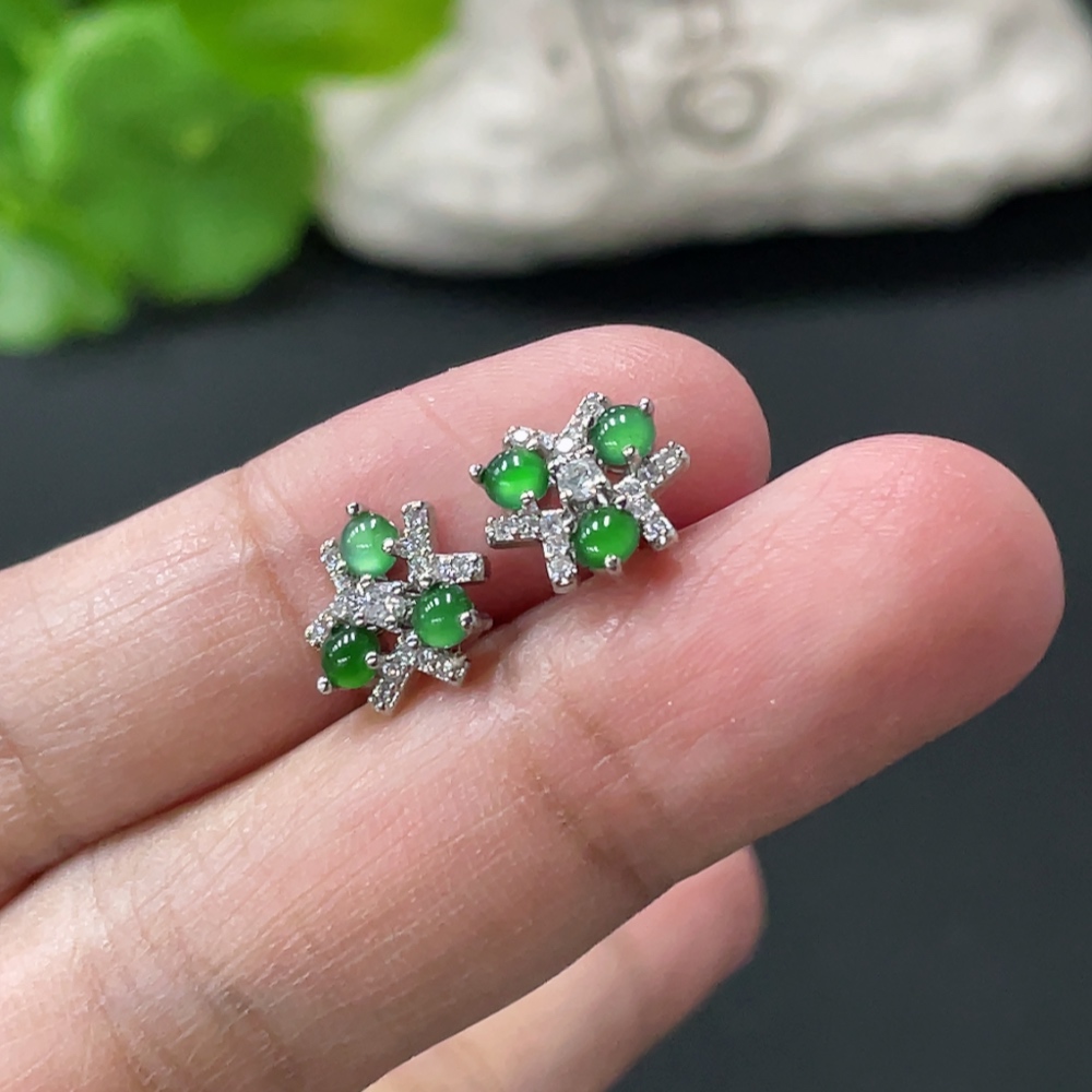 F35109732 A pair of jadeite cabochon ear studs without gold inlay, total weight approximately 1.43g