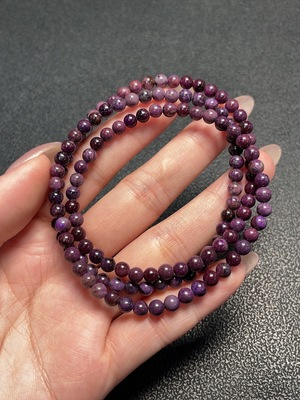 C34009644 Sugilite Bead Strand (with mineral inclusions)