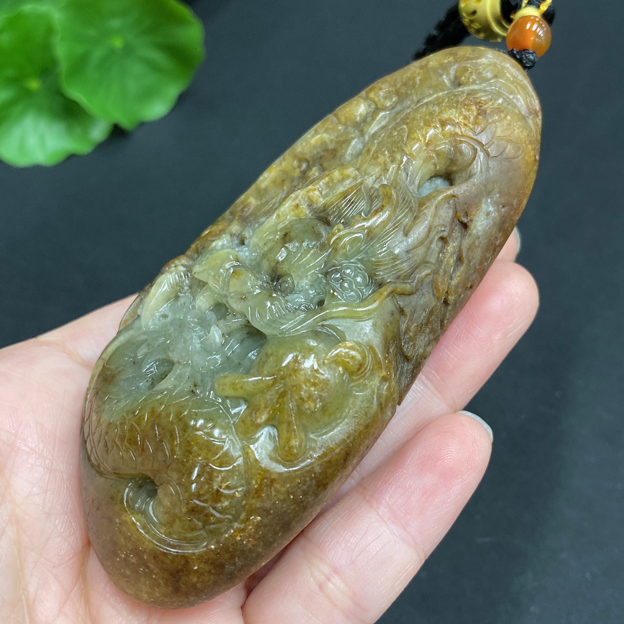 H22439310 Hetian Jade Pendant  Dragon  Total Weight (including rope) 139.7g  Undetermined skin color origin  Contains other natural mineral components