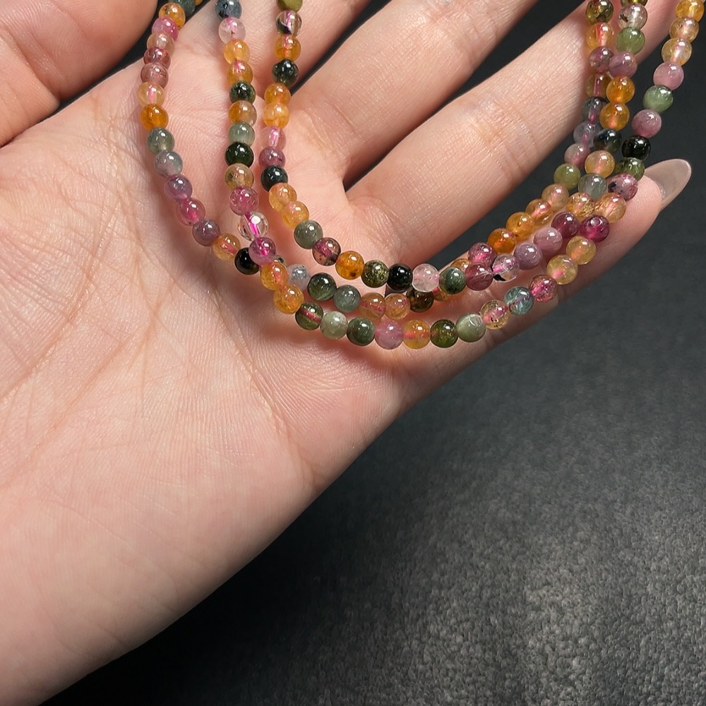 C34008843 Tourmaline bead strand with other mineral components, visible organic matter, total weight approx. 17.98g, size approx. 3.9mm