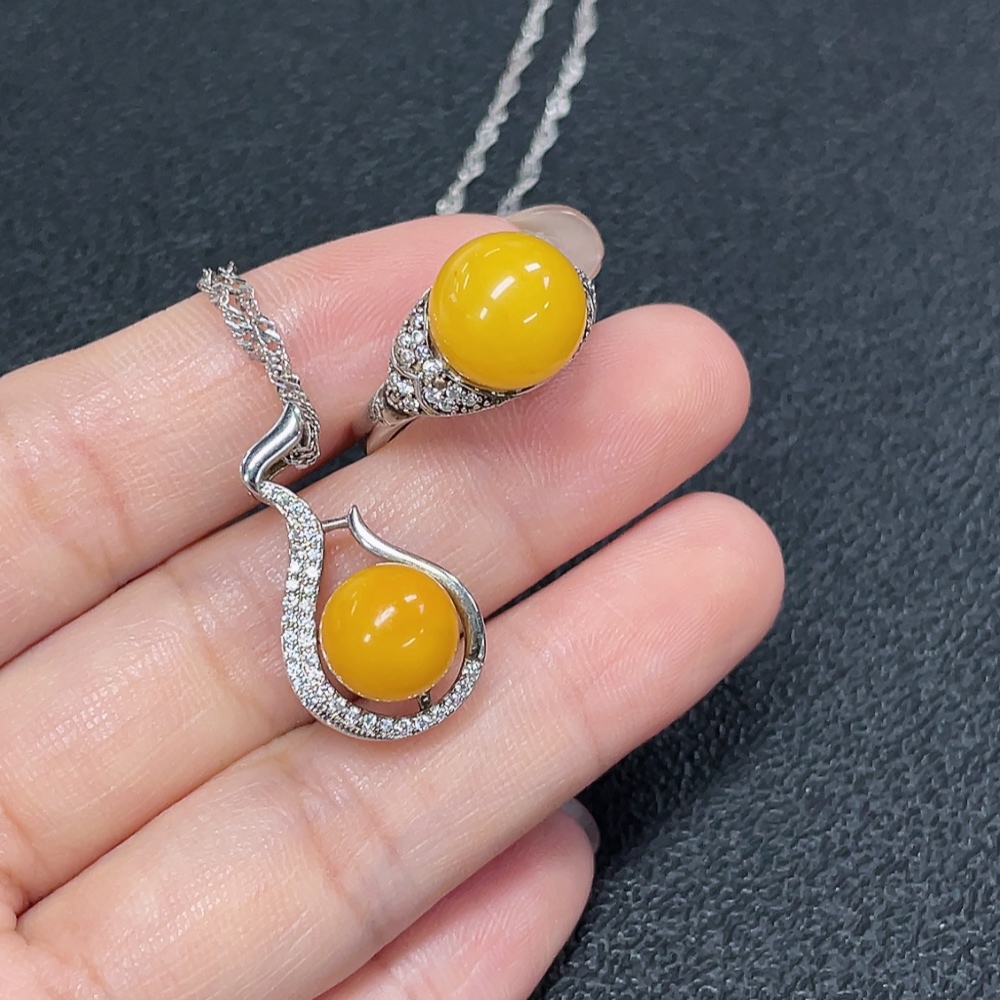 C29368481 Amber Beeswax Pendant + Ring Adjustable Non-Gold Total Weight Approx. 7.72g Sell as a Lot