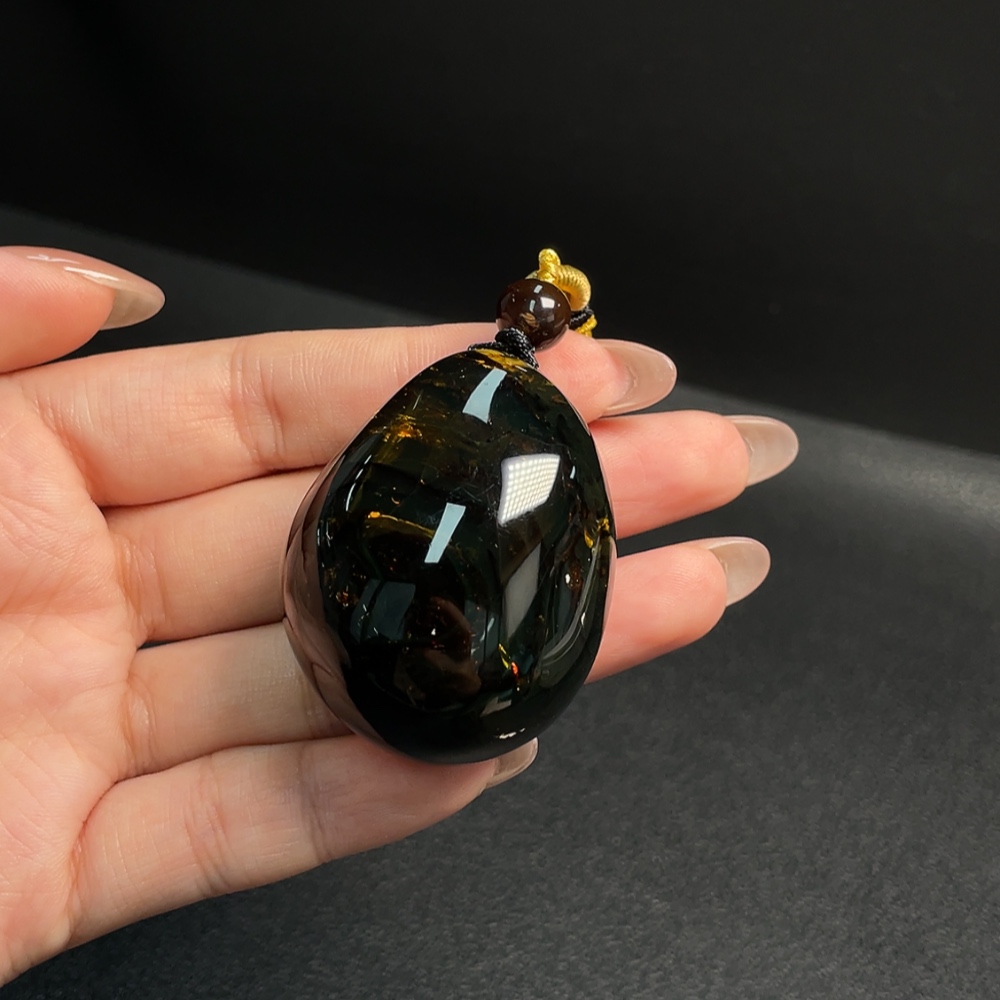 C31619792 Amber and Beeswax Pendant, Total Weight Approx. 27.15g Including Rope