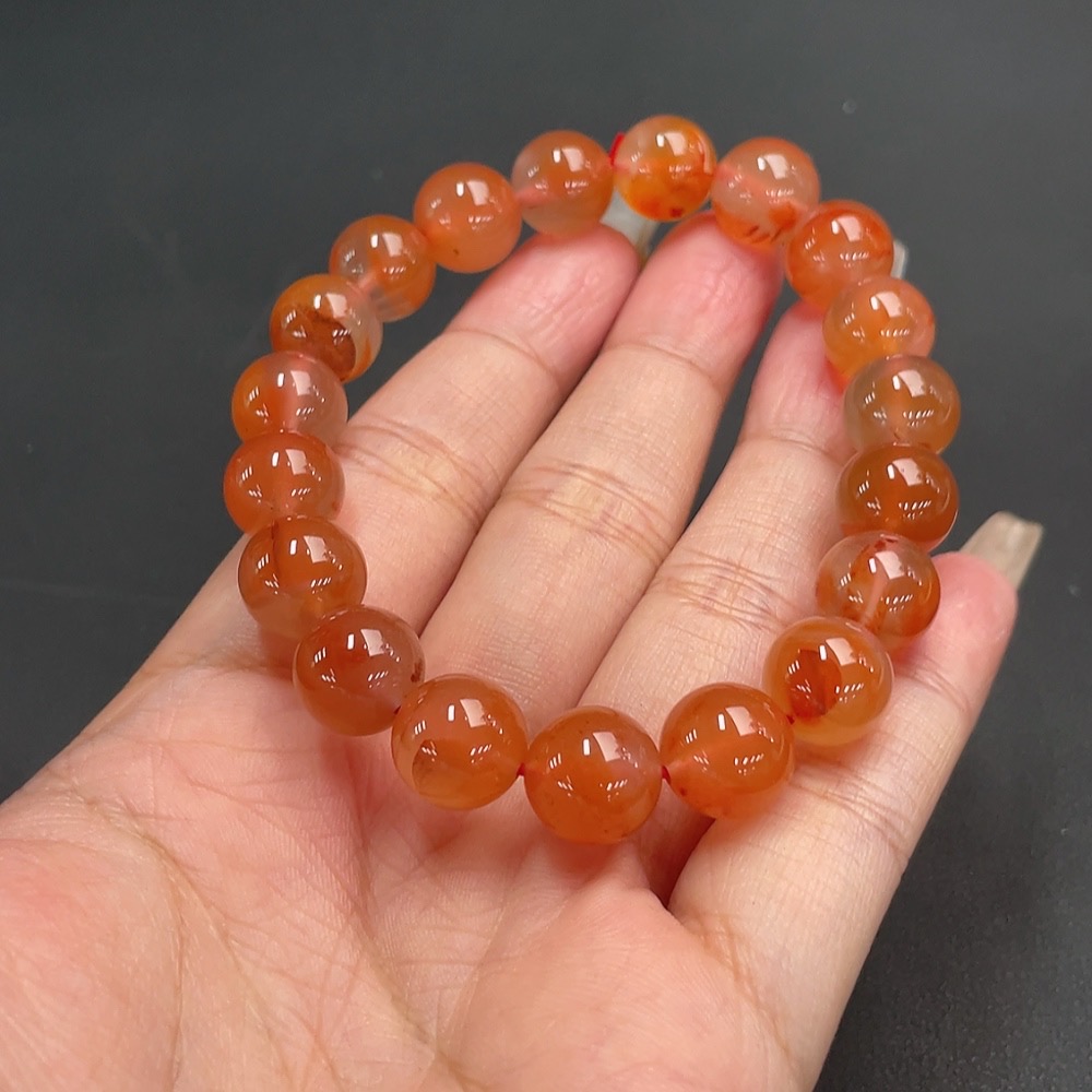 C21311547 South Red Agate Bracelet, approx. 11mm beads, total weight about 36.06g, organic matter visible