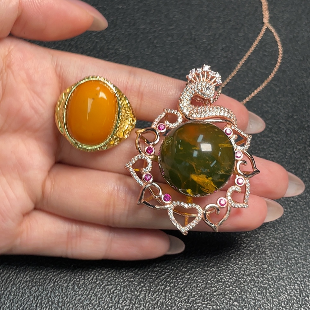 C34993222 Amber Beeswax Pendant + Ring Adjustable Non-Gold Total Weight Approx. 30.75g Sell as a Lot