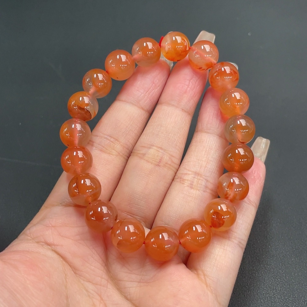 C21311547 South Red Agate Bracelet, approx. 11mm beads, total weight about 36.06g, organic matter visible