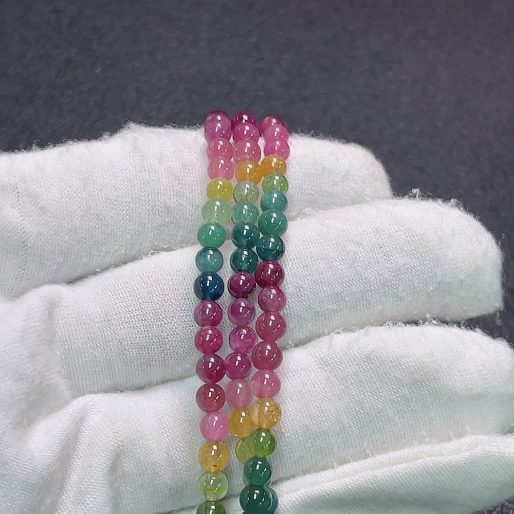 C33922632 Tourmaline bead strand with visible organic matter, total weight approx. 15.48g, bead size approx. 4mm