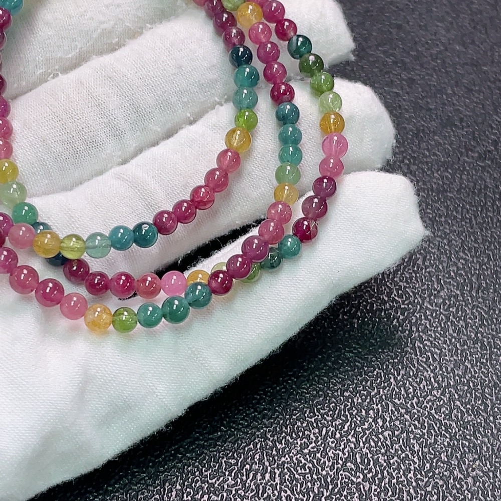 C33922632 Tourmaline bead strand with visible organic matter, total weight approx. 15.48g, bead size approx. 4mm