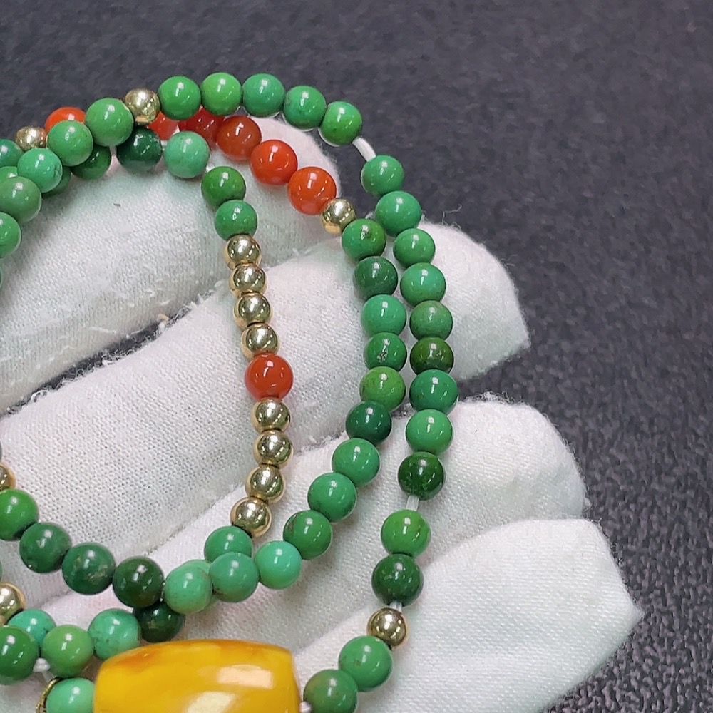 C33922751 Turquoise bead strand with amber and southern red agate, color origin undetermined, containing other mineral components, non-gold, total weight approximately 17.37g, bead size about 4.4mm