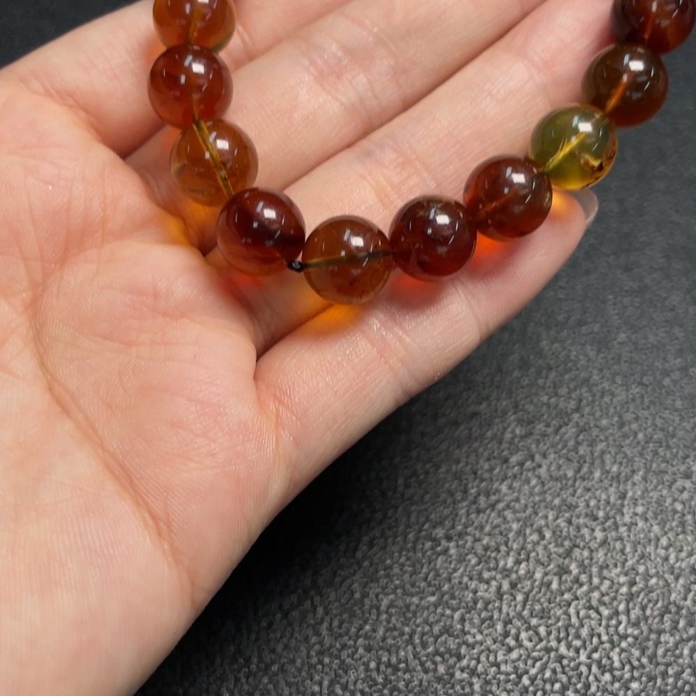C29403695 Amber Beeswax Bracelet, approx. 9.9mm, total weight approx. 10.53g