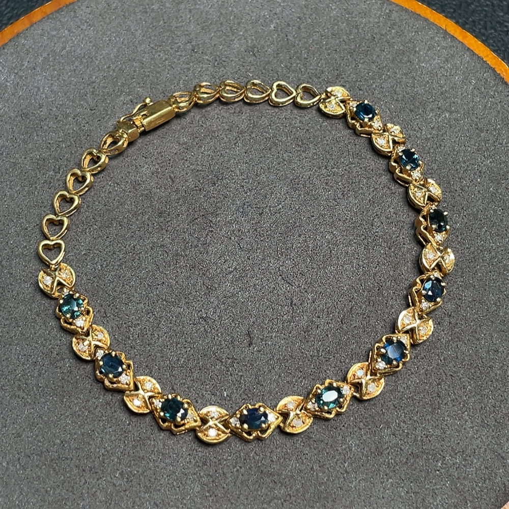 C33922202 Sapphire bracelet, color origin undetermined, accented with diamonds, no imprint, surface gold content approximately 75%, total item weight about 10.19 grams
