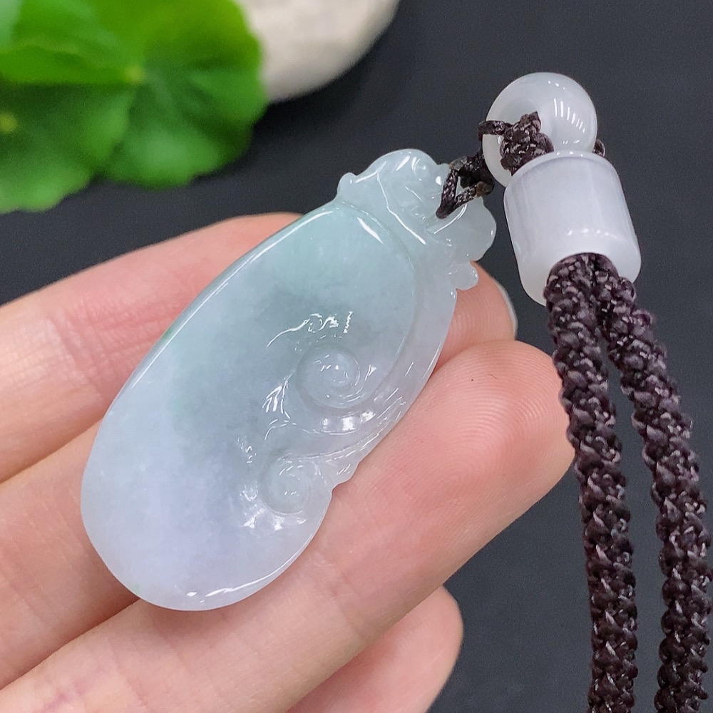 F33832095 Jadeite Ruyi Pendant Total weight approx. 13.4g (including cord weight) Matching beads not jadeite