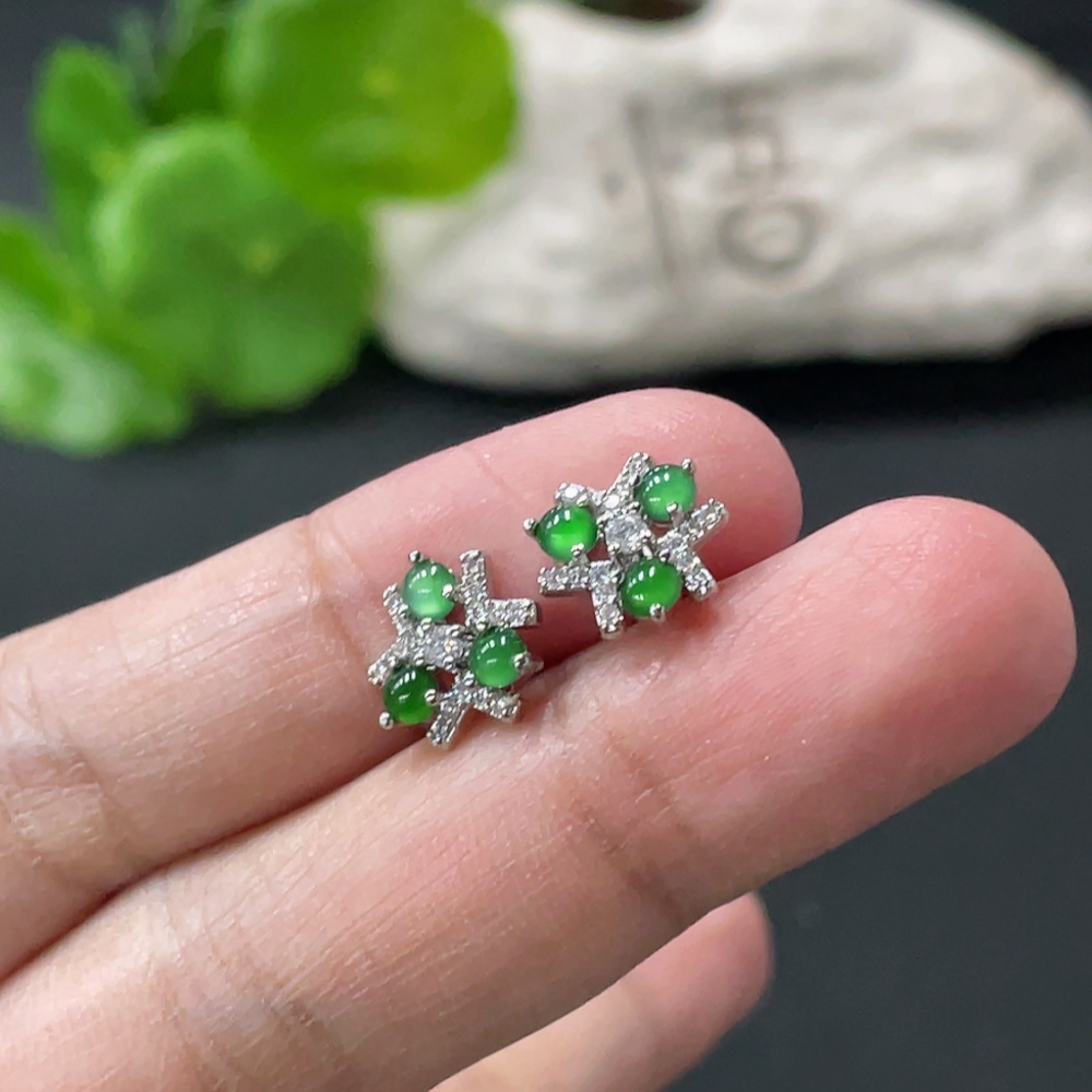 F35109732 A pair of jadeite cabochon ear studs without gold inlay, total weight approximately 1.43g