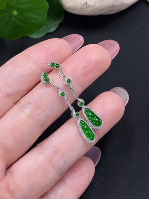 F34982006 Jadeite earrings set in 18K gold with diamonds, total weight approximately 2 grams per pair