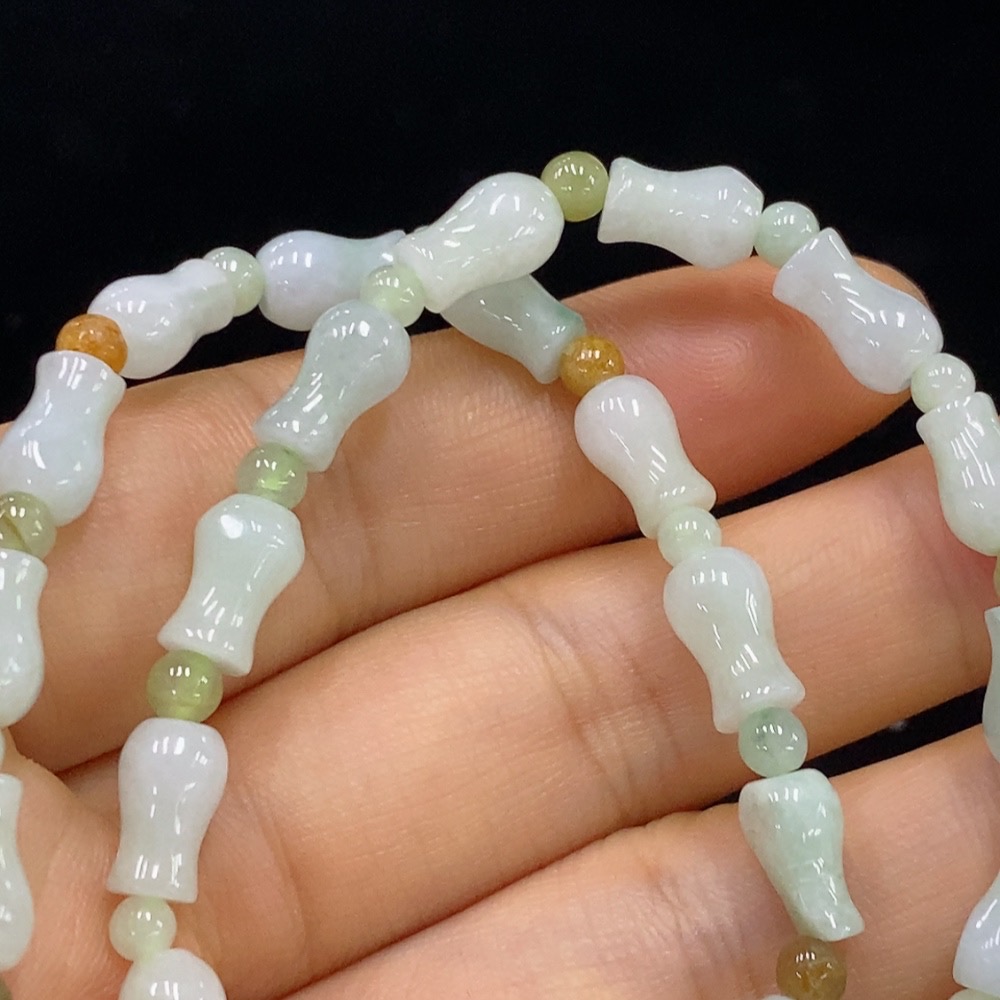 F34948624 Jadeite bracelet non-gold yellow color origin undetermined