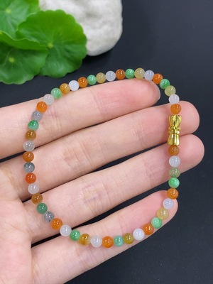 F42977355 翡翠手串 非金 货品总重量约5.7克 卡4mm左右 黄珠颜色成因未定