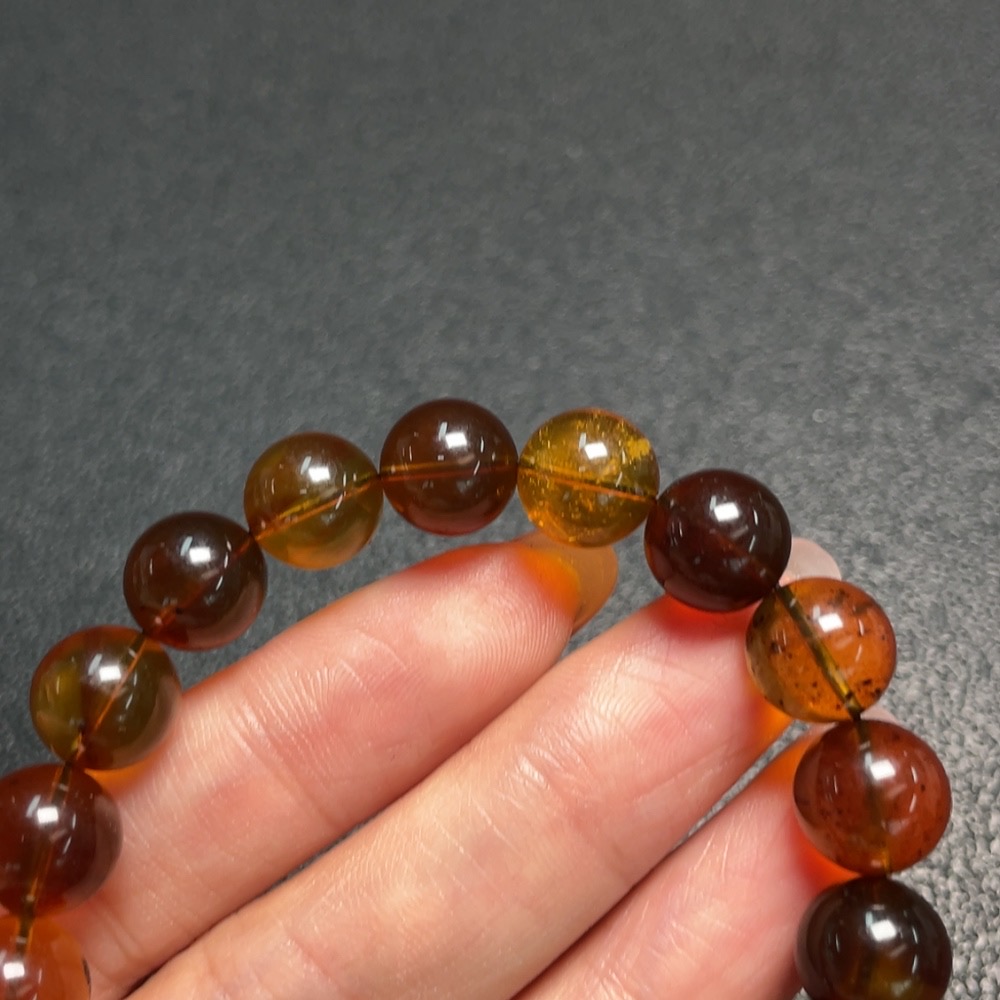 C29403695 Amber Beeswax Bracelet, approx. 9.9mm, total weight approx. 10.53g