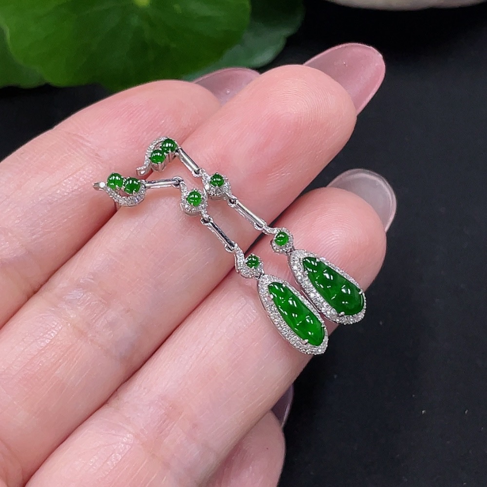 F34982006 Jadeite earrings set in 18K gold with diamonds, total weight approximately 2 grams per pair