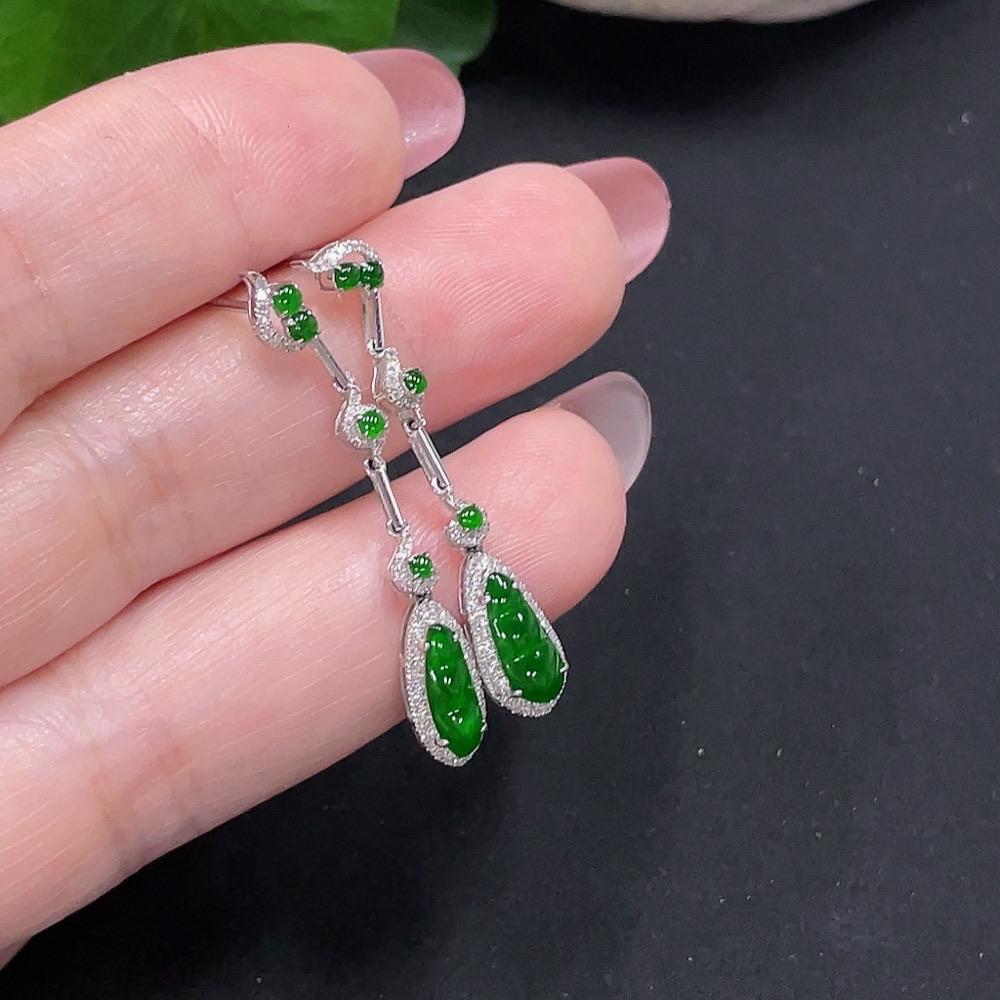 F34982006 Jadeite earrings set in 18K gold with diamonds, total weight approximately 2 grams per pair