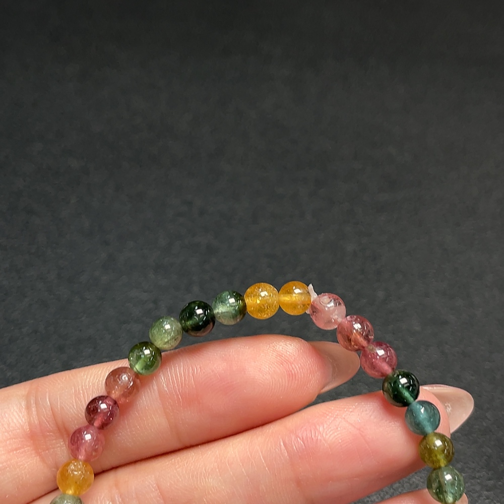 C33870451 Tourmaline bracelet containing other mineral components, visible organic matter, total weight approx. 7.70g, bead size about 5mm