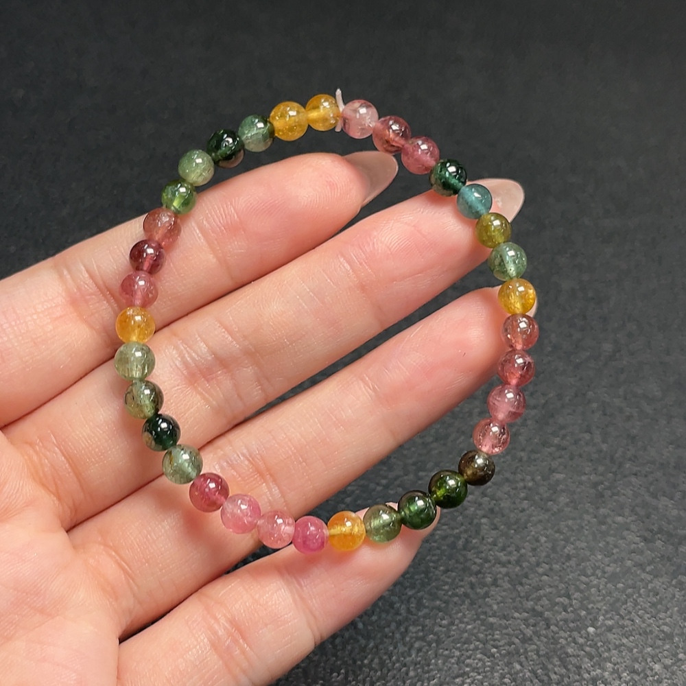 C33870451 Tourmaline bracelet containing other mineral components, visible organic matter, total weight approx. 7.70g, bead size about 5mm