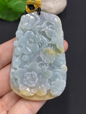 F35163715 Jadeite Flower of Prosperity Pendant with a total weight of approximately 58 grams including the cord