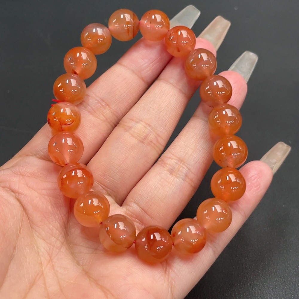 C21311547 South Red Agate Bracelet, approx. 11mm beads, total weight about 36.06g, organic matter visible