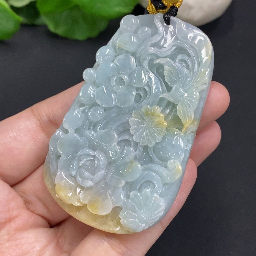 F35163715 Jadeite Flower of Prosperity Pendant with a total weight of approximately 58 grams including the cord