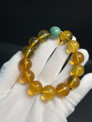 C33921132 Amber Beeswax Bracelet with Turquoise (color origin undetermined) containing other mineral components, total weight approx. 31.69g, size approx. 14.7mm