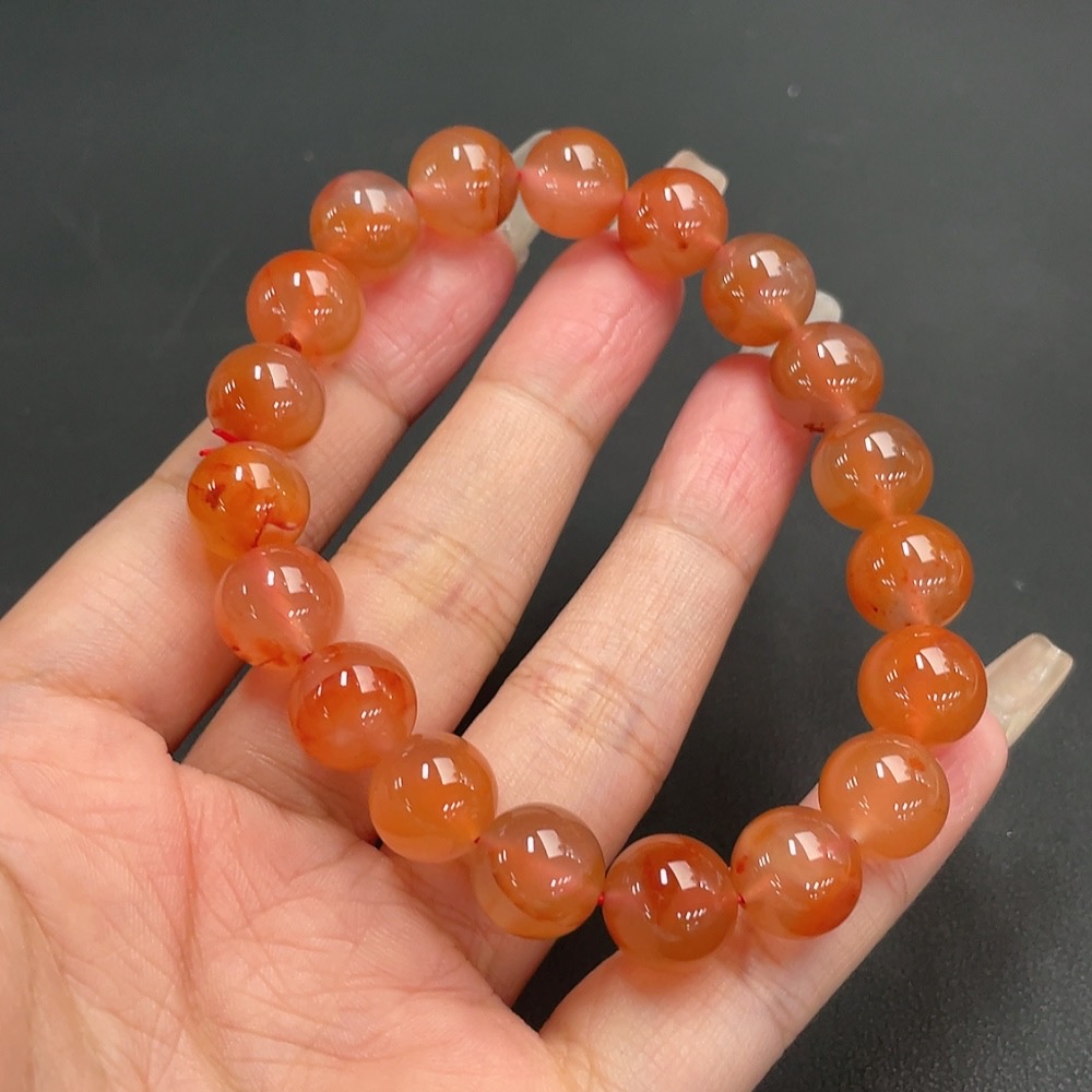 C21311547 South Red Agate Bracelet, approx. 11mm beads, total weight about 36.06g, organic matter visible