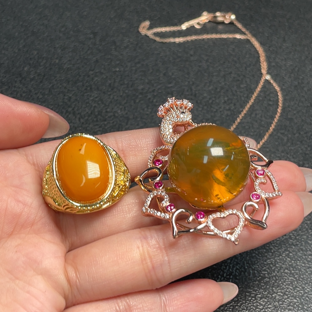 C34993222 Amber Beeswax Pendant + Ring Adjustable Non-Gold Total Weight Approx. 30.75g Sell as a Lot