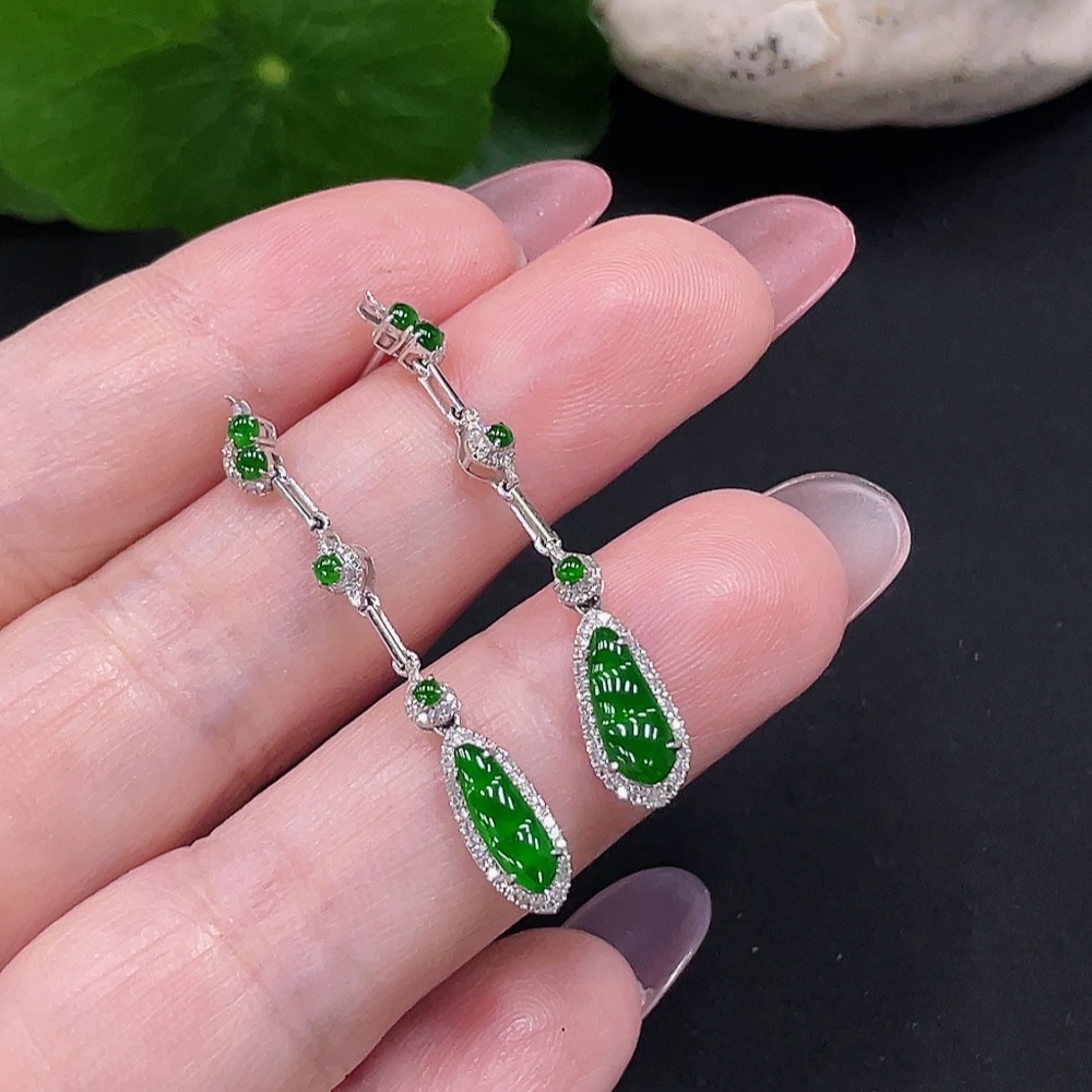 F34982006 Jadeite earrings set in 18K gold with diamonds, total weight approximately 2 grams per pair