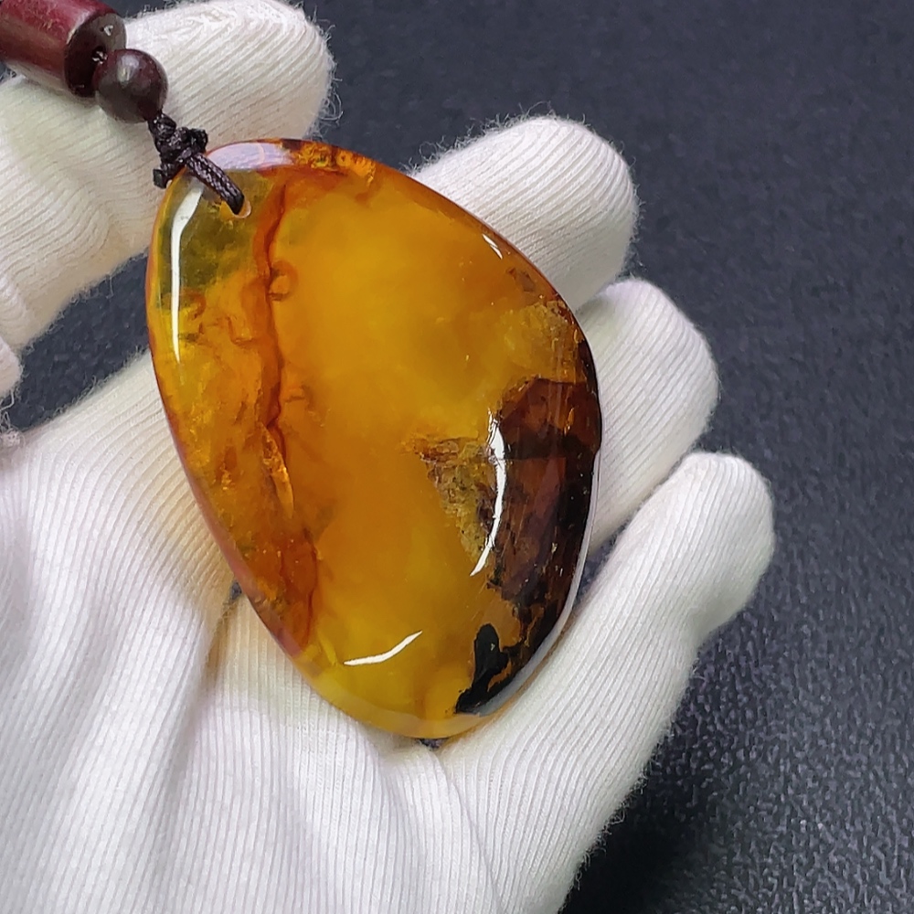 C30474274 Amber Beeswax Pendant with Partial Visible Repairs, Total Weight Approx. 16.91g Including Cord