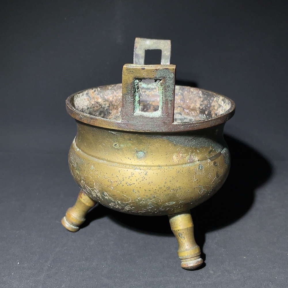 W28238912 Miscellaneous Late Qing and Republic Period Three-legged Double-handled Copper Incense Burner with Floral Engravings