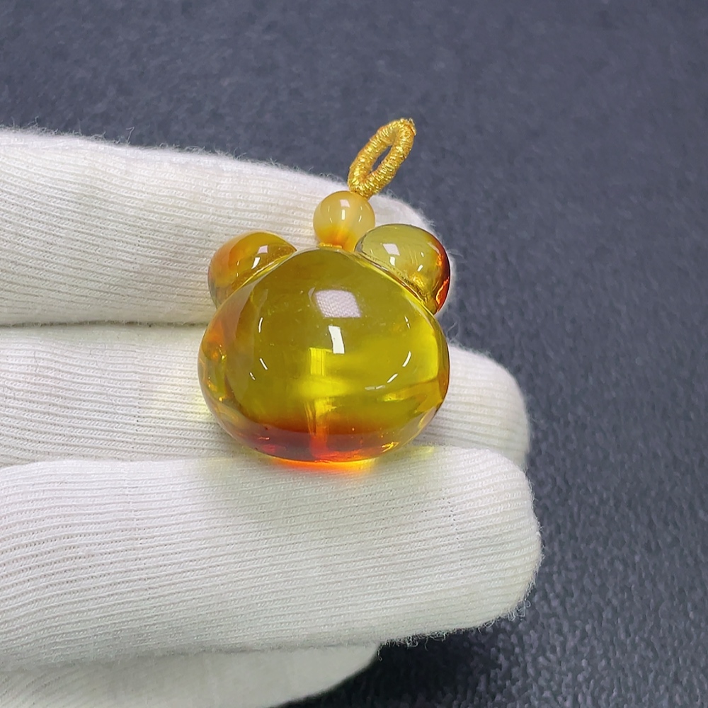 C30474515 Amber beeswax pendant coated, total weight approx. 6.38g