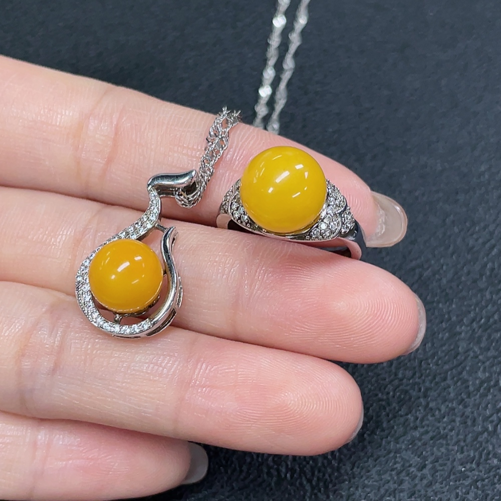 C29368481 Amber Beeswax Pendant + Ring Adjustable Non-Gold Total Weight Approx. 7.72g Sell as a Lot