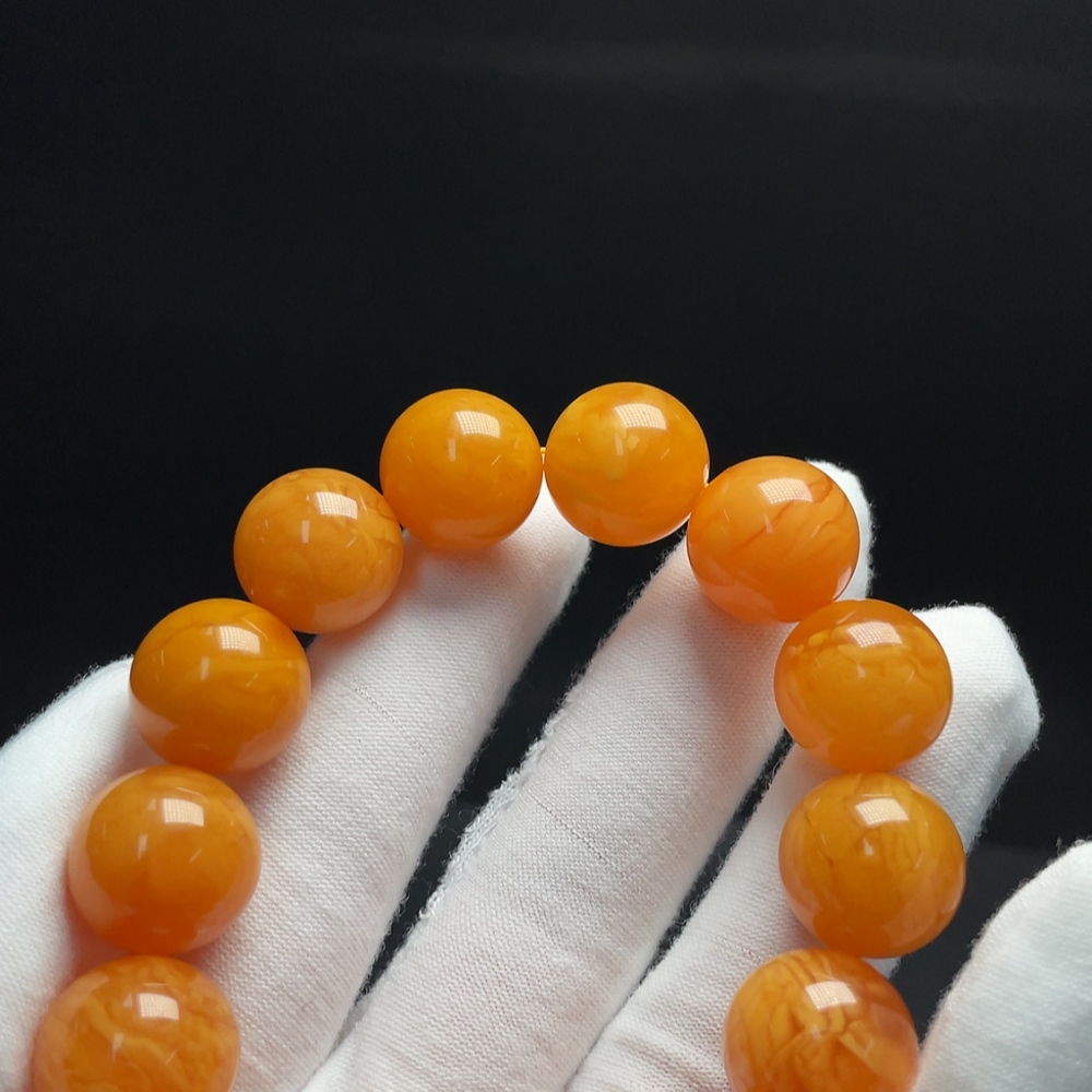 C34009947 Amber Beeswax Bracelet Total weight about 30.13g Size about 15.7mm Color origin undetermined