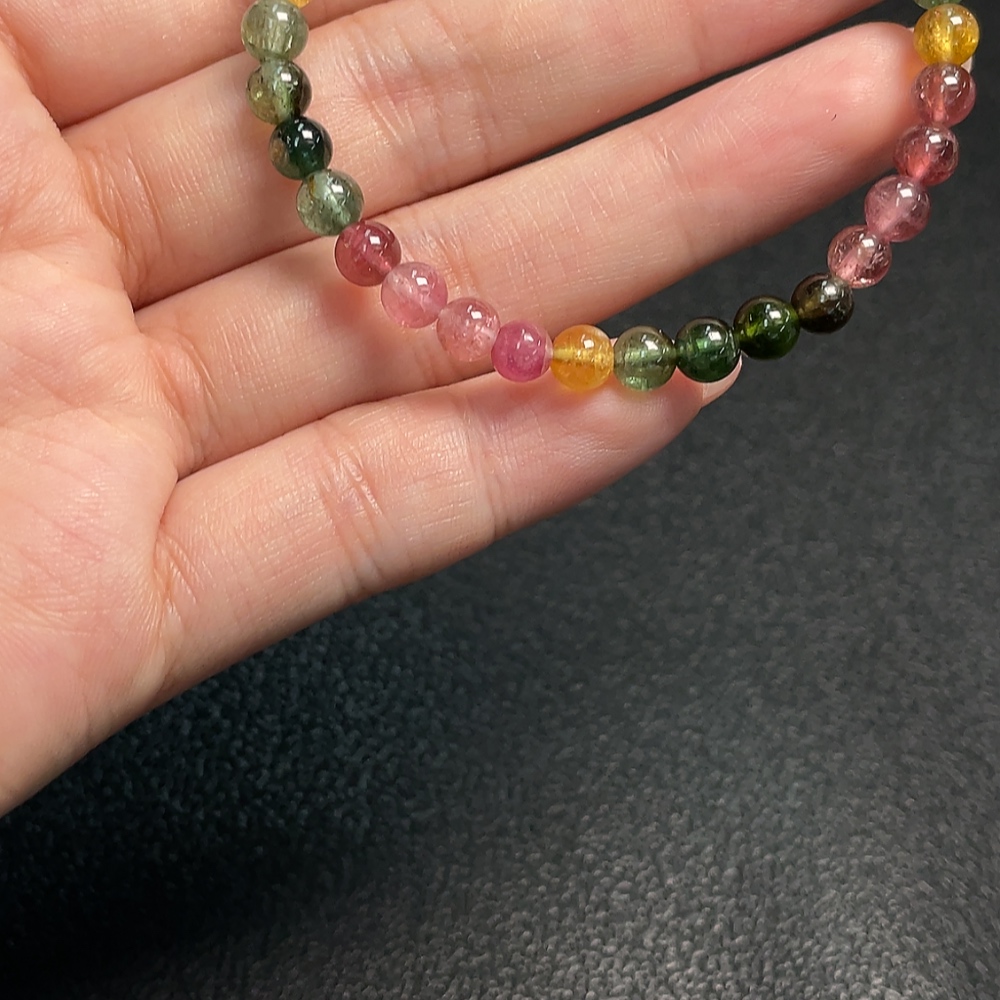C33870451 Tourmaline bracelet containing other mineral components, visible organic matter, total weight approx. 7.70g, bead size about 5mm