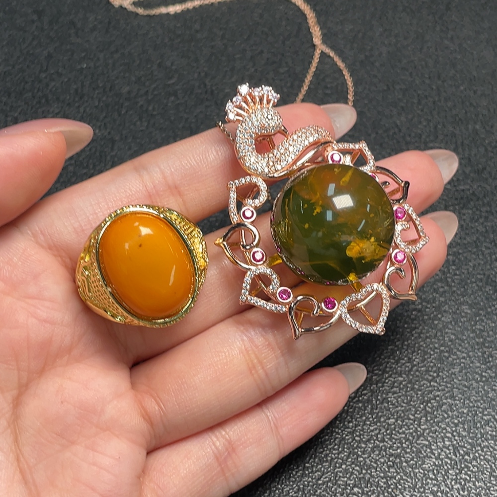 C34993222 Amber Beeswax Pendant + Ring Adjustable Non-Gold Total Weight Approx. 30.75g Sell as a Lot