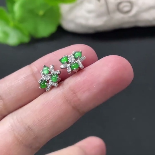 F35109732 A pair of jadeite cabochon ear studs without gold inlay, total weight approximately 1.43g