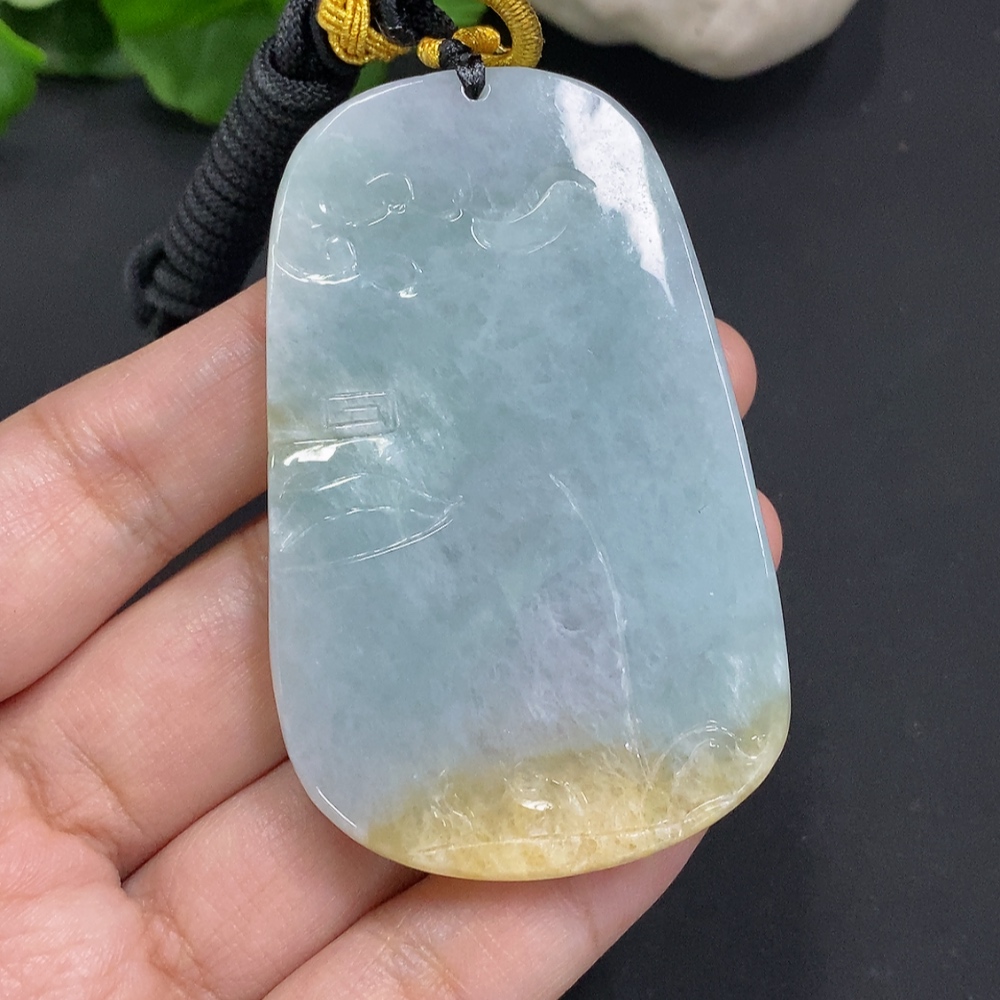 F35163715 Jadeite Flower of Prosperity Pendant with a total weight of approximately 58 grams including the cord