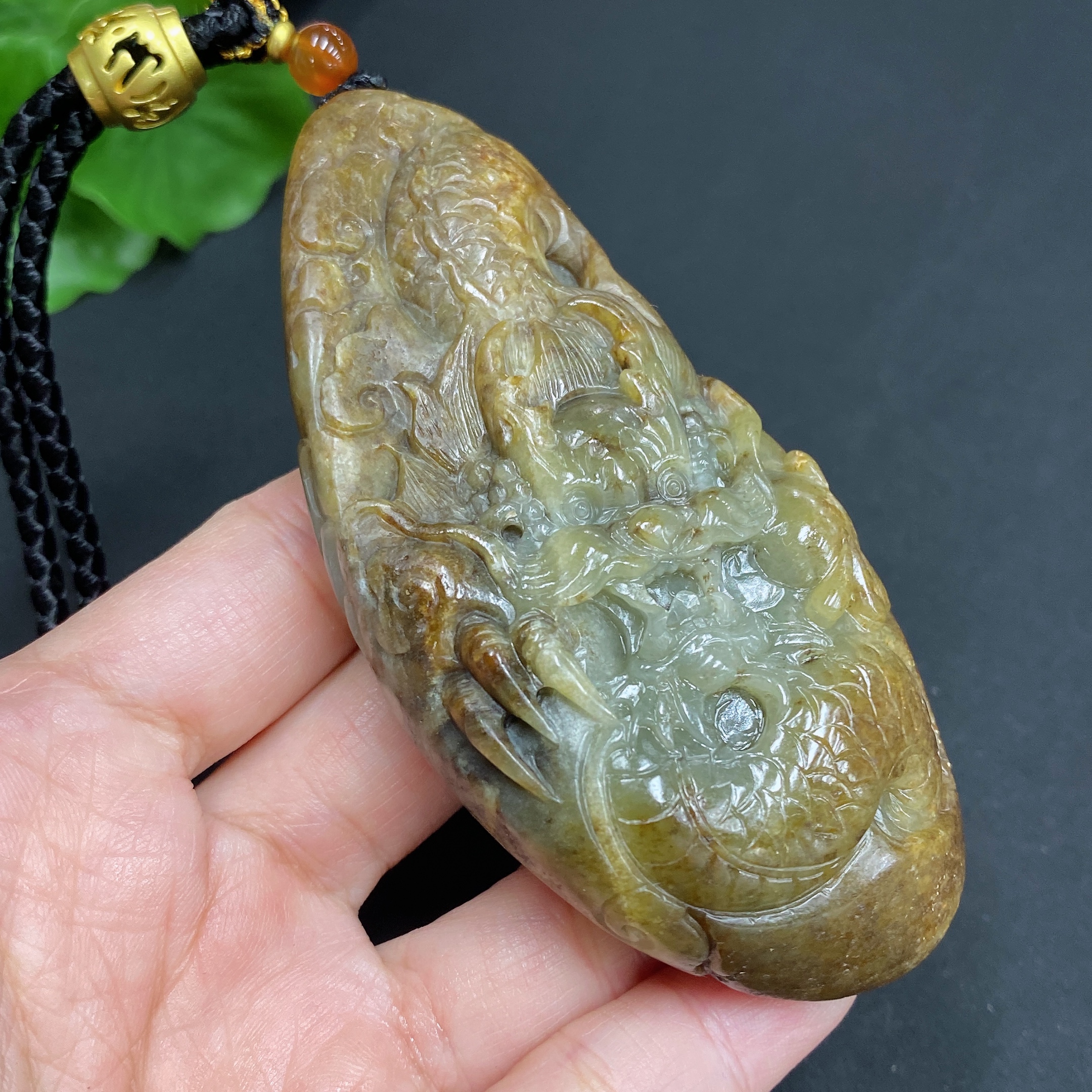 H22439310 Hetian Jade Pendant  Dragon  Total Weight (including rope) 139.7g  Undetermined skin color origin  Contains other natural mineral components