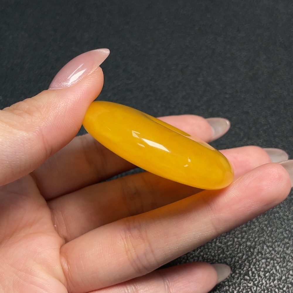 C34009607 Amber Beeswax Pendant with a total weight of approximately 17.71 grams