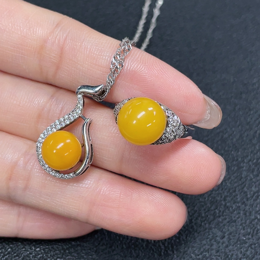 C29368481 Amber Beeswax Pendant + Ring Adjustable Non-Gold Total Weight Approx. 7.72g Sell as a Lot